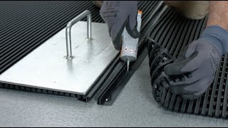 How to Install Snap Track Joining Strip on Workplace Matting - This video demonstrates how to install the PVC Edging on these products:
Heronair, Firmagrip, Vynagrip 

Make sure your matting has been laid out to acclimatise and relax completely.

Measure how much Snap Track you need.
Cut to fit.
Apply cold weld paste to piece 1.
Fit to edge of matting.
Apply weights and leave to dry.
Cut protruding base bars on the other piece of matting so Snap Track sits flush.
Apply cold weld paste to piece 2.
Fit to edge of matting.
Apply weights and leave to dry.
Join 2 pieces and push them together.

See all Industrial Flooring:
https://www.greatmats.com/industrial-flooring.php

Call Us at 877-822-6622 or visit Greatmats.com for all your specialty flooring needs!

#matting #industrialflooring #flooring