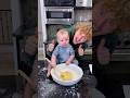 A baby makes crepes