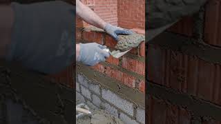 Brick wall construction work.