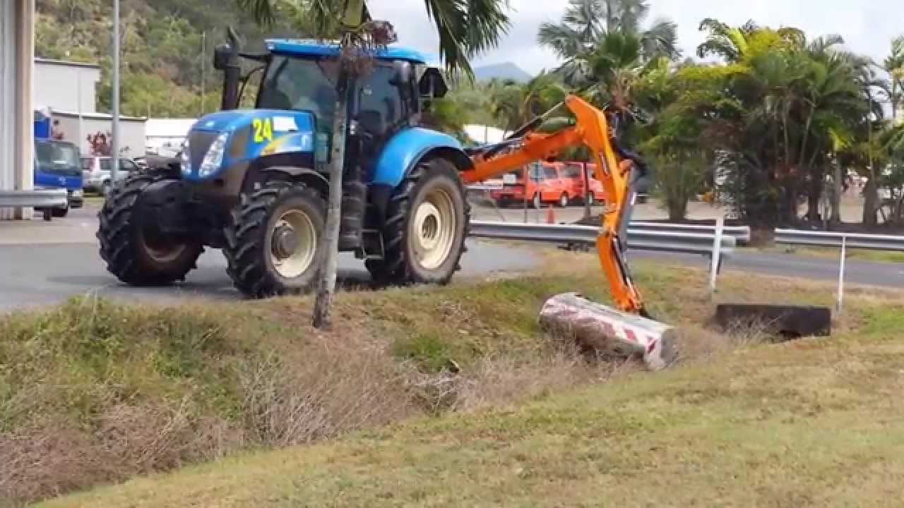 Noremat Reach Mower cutting grass, drain cleaning