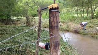 How to build a fence across a creek How to build a barbed wire fence across a stream, pond, water area.