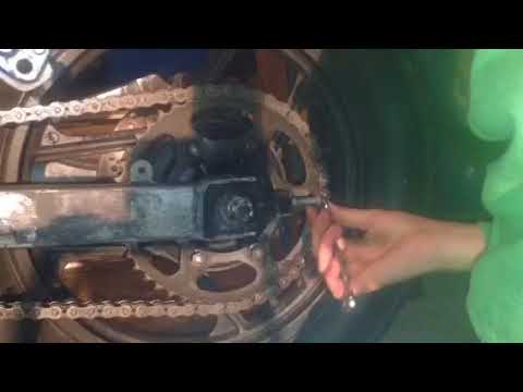 How to tighten a motorcycle chain - YouTube