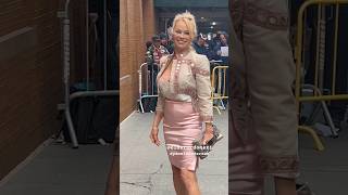 Pamela Anderson walks with Style Gives The Peace Sign looking amazing Arriving At the View in NYC