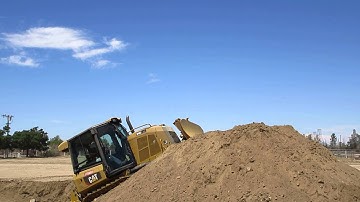 HEO CHRIS MATA GOIN OVER HILL IN DOZER