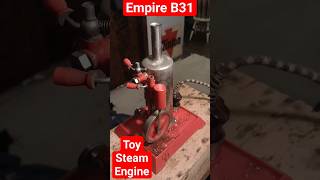 playing with a toy empire steam engine