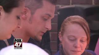 Friends and family hold candlelight vigil to remember homicide victim
