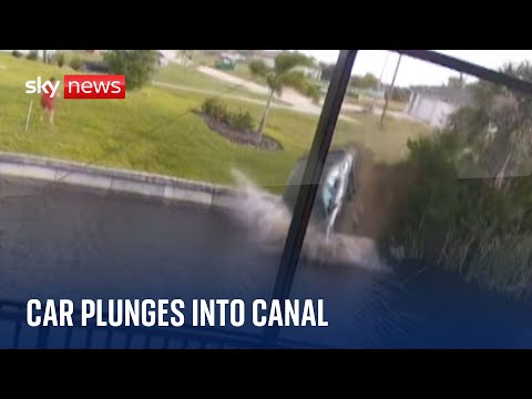 Car plunges into canal after 80mph race before driver is rescued