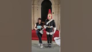 King's Guard smiles when his mum visits him on duty at Horse Guards. 18.06.2023.