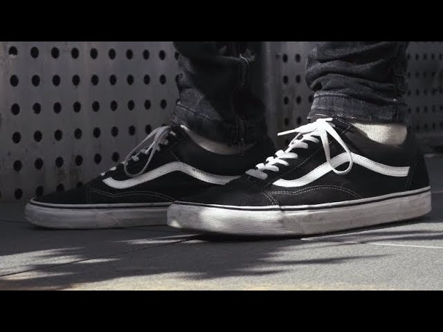 black and white vans on feet