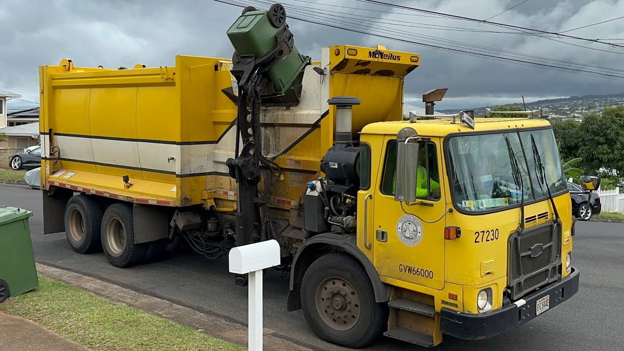 Autocar ACX McNeilus Autoreach Garbage Truck on Greenwaste Wheelie Bins