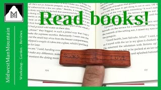 MMM 97 READ MORE BOOKS! This simple tool for your thumb will allow anyone, regardless of hand size, to hold a book entirely 