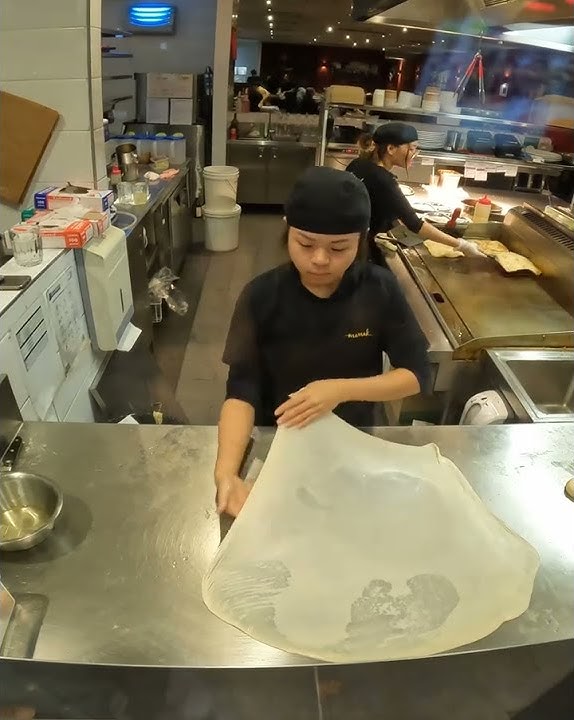 Lady Masterfully Flipping Roti Prata Into Perfection #shorts