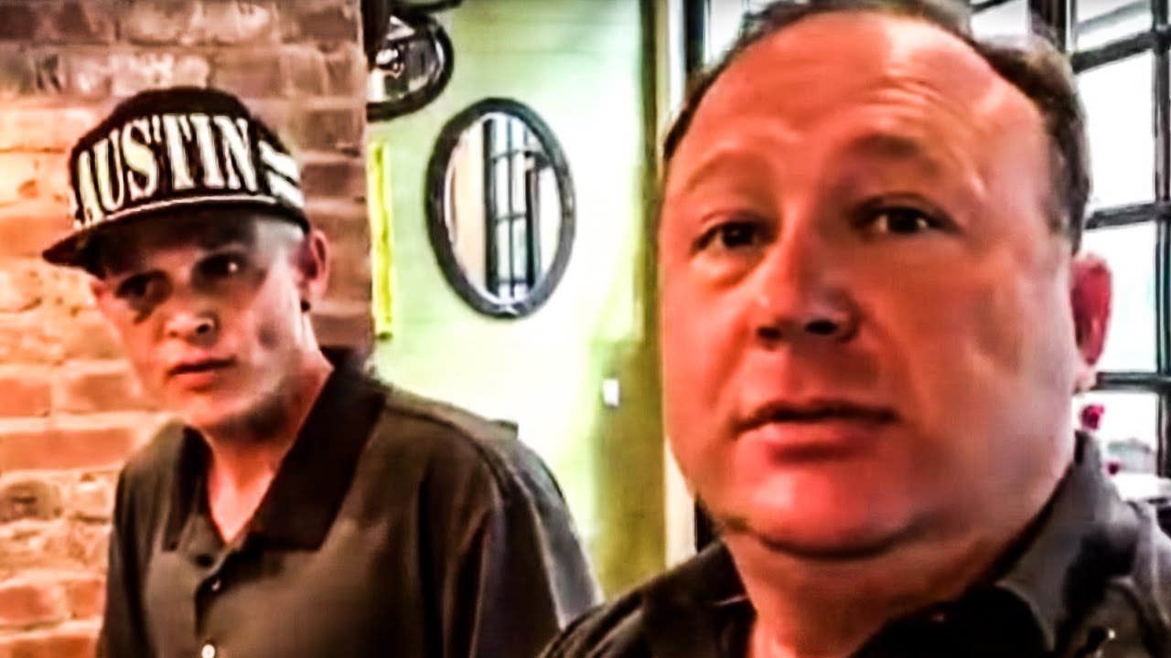 Alex Jones Hilariously Runs Away from His Own Insane Fan