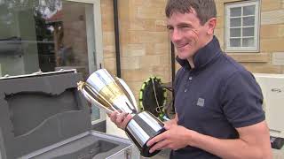 Brian Hughes receives Champion Jump Jockey trophy in surprise visit