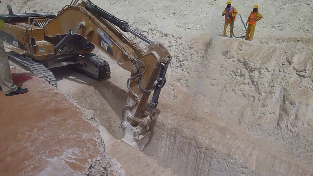 Kemroc KR400 Drum Cutter on CAT385 Trenching in hard limestone