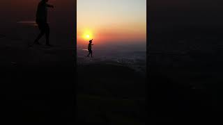 Athlete on a 100 Meters High Highline Enjoying a Majestic Sunset