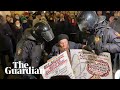 Russian activist, 77, detained by police while protesting against Ukraine war - Guardian News