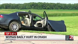 Woman in critical condition after crash with semi