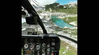 MD500 taking off in the Swiss Alps.