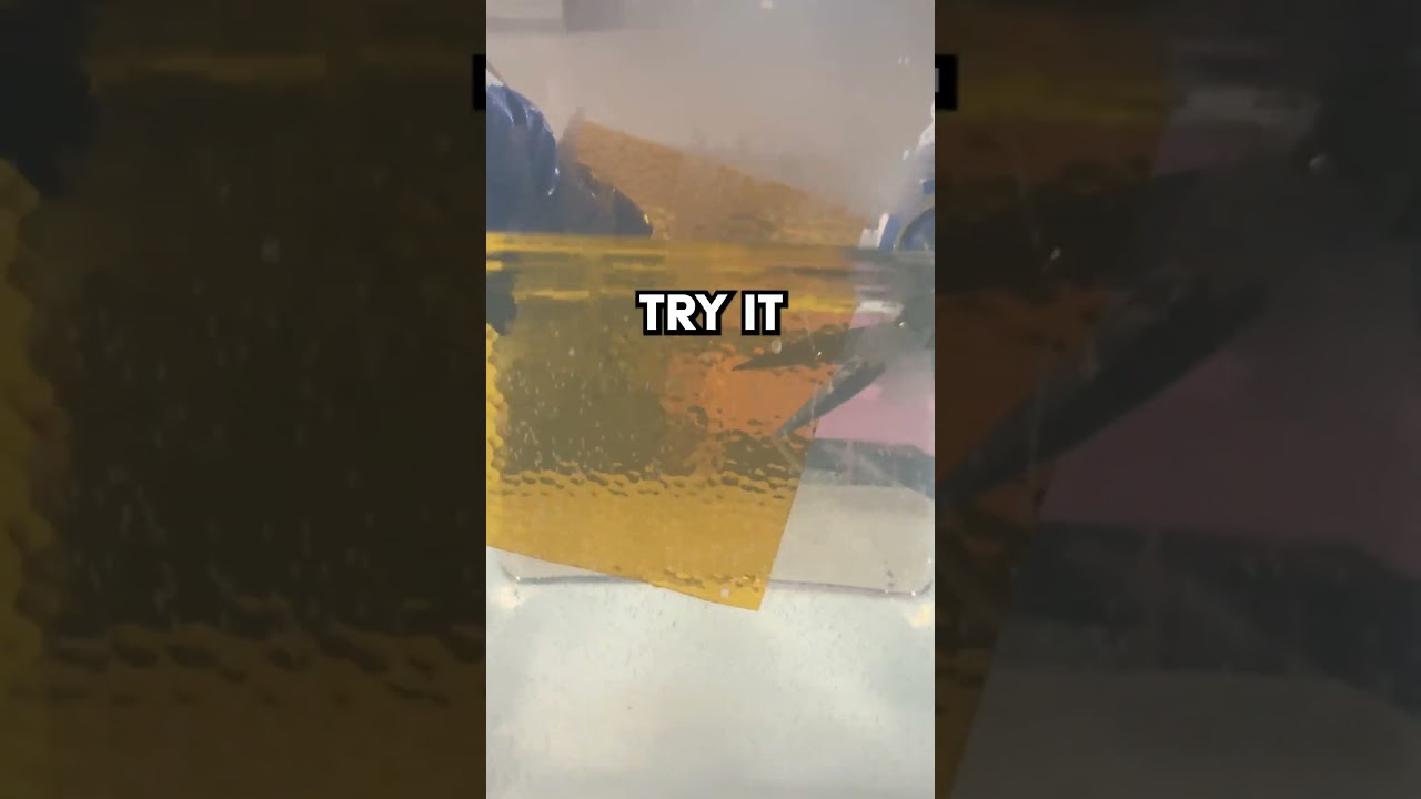 Cutting Glass Underwater Using Scissors 