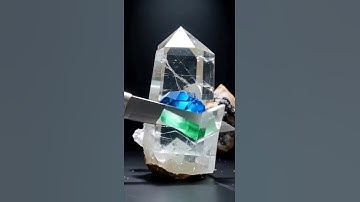 Super-sharp knife slices obsidian, quartz, emerald, and sapphire at extreme slow-motion