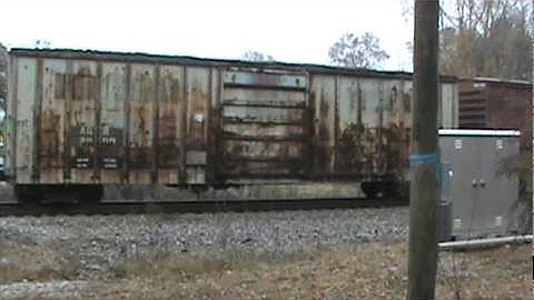 CSX 799 leads Q600 at Madras, in Newnan, GA