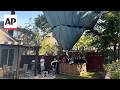 Hot air balloon with 13 people makes emergency landing in California backyard