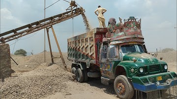 Rock Crushing Plant and Caterpillar Wheel Loader 950E Working on Rock Loading Crash Plant