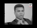 An ungleeful looking Cassius Clay -- "call me Muhammad Ali" said he was elated over his 7th round kn