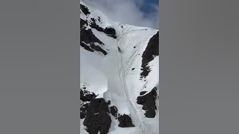 Snowmobiler Sends Sled Off The Top Of A Mountain! #sendit #comedy