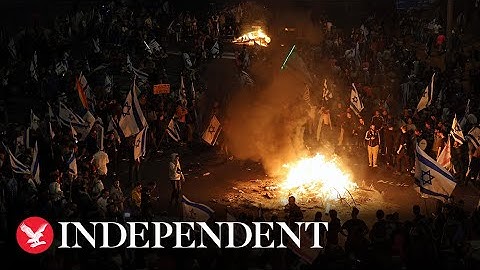 Israeli protesters light fire and block highway as Netanyahu sacks minister