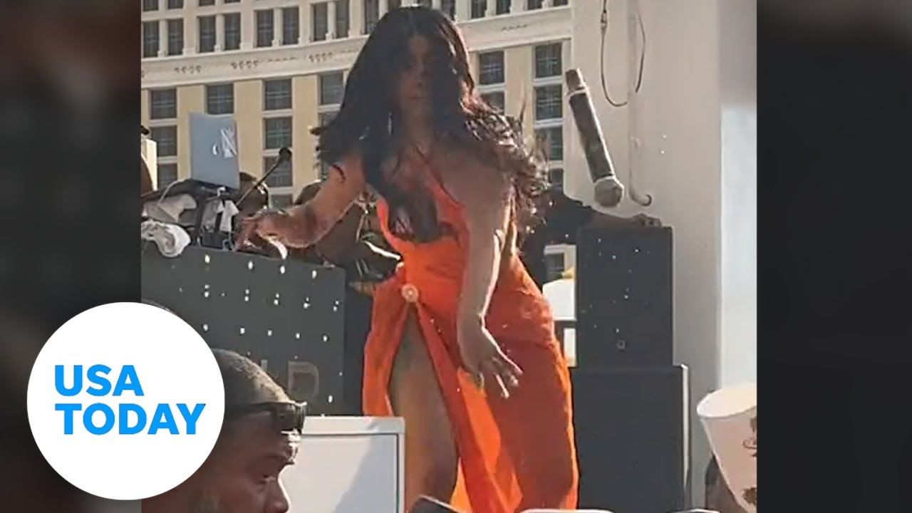 Audience member throws drink on Cardi B, she throws microphone back | USA TODAY