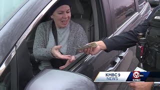 Shawnee police officers give out $100 Secret Santa bills to unsuspecting drivers