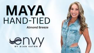 MAYA HAND-TIED Wig by Envy in Almond Breeze. Glossy, cascading waves and soft, face-framing layers.