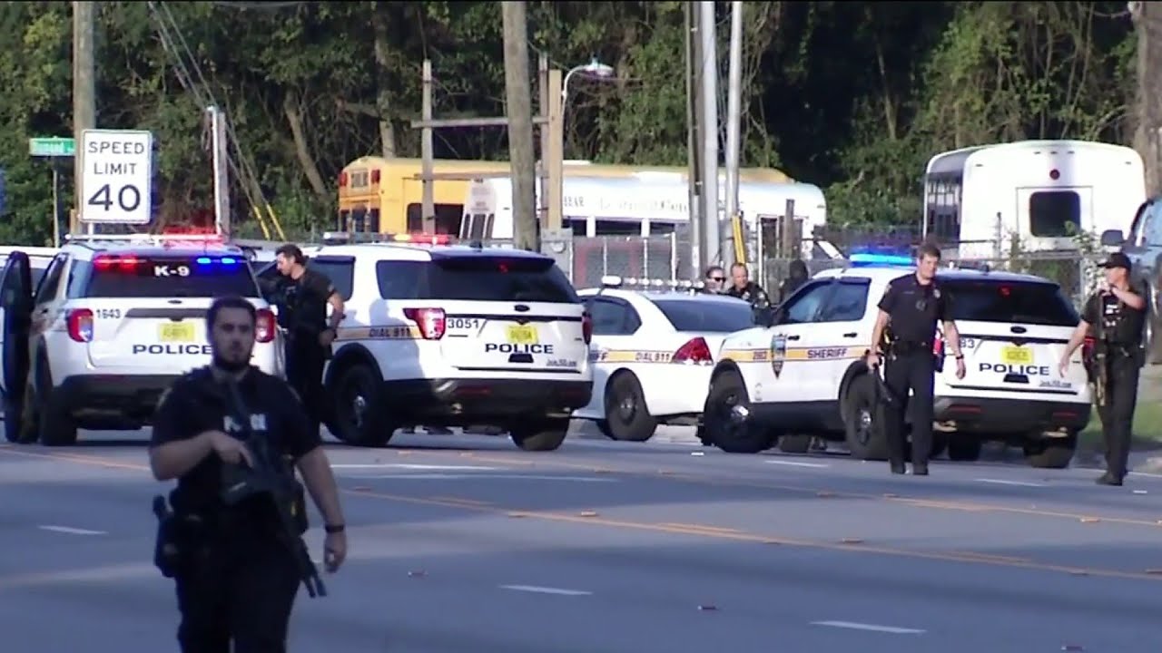 Man taken into custody following exchange of gunfire with officers ...