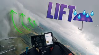Glider flying and climbing in rain