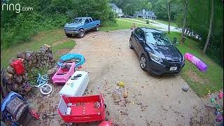 Girl pushes little sister down driveway in wagon/cart and falls into kiddie pool (Security camera)