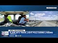 United flight hits bakery truck, highway light pole during landing