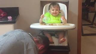 Dad playing peek-a-boo with 1 year old