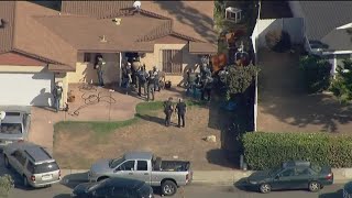 Wanted fugitive surrenders peacefully after prompting SWAT standoff in San Diego neighborhood