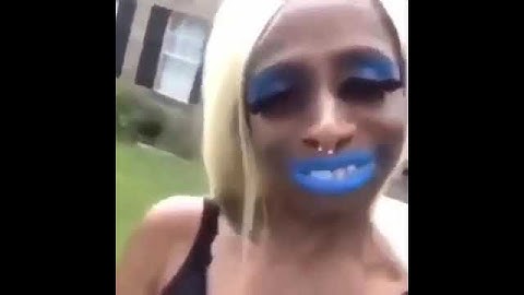 Black lady speaks gibberish with blue lipstick