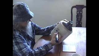 Tommy Hall of The 13th Floor Elevators signing a jug for Kickstarter