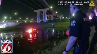Orlando police rescue driver from partially submerged vehicle