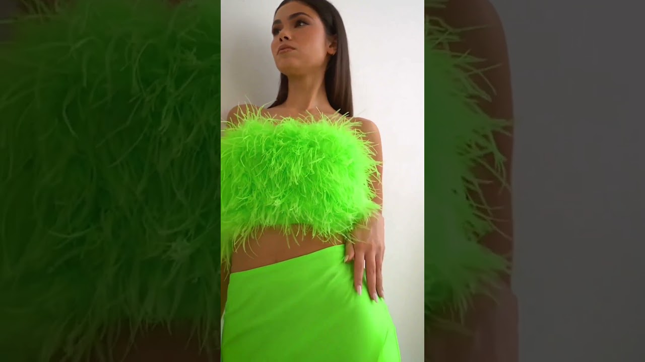 The form-fitting stretch skirt and strapless faux feather tube top C141