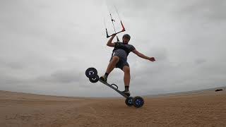 Man Performs Amazing Tricks With Longboard While Attached to Kite - 1207411