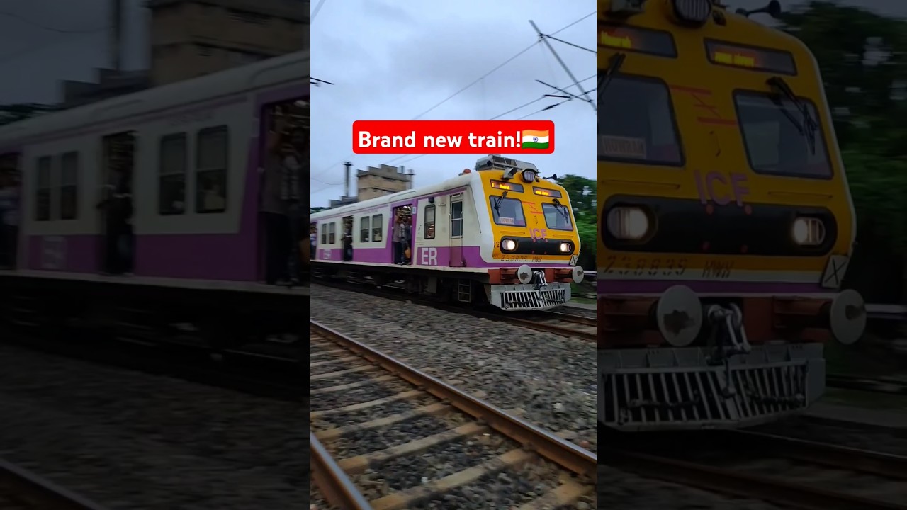 Brand new shiny colourful EMU local train crossing railgate! 