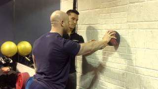Rhythmic Stabilization - Standing 1A. MB on wall + Perturbations