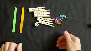 clothespins on a popsicle stick