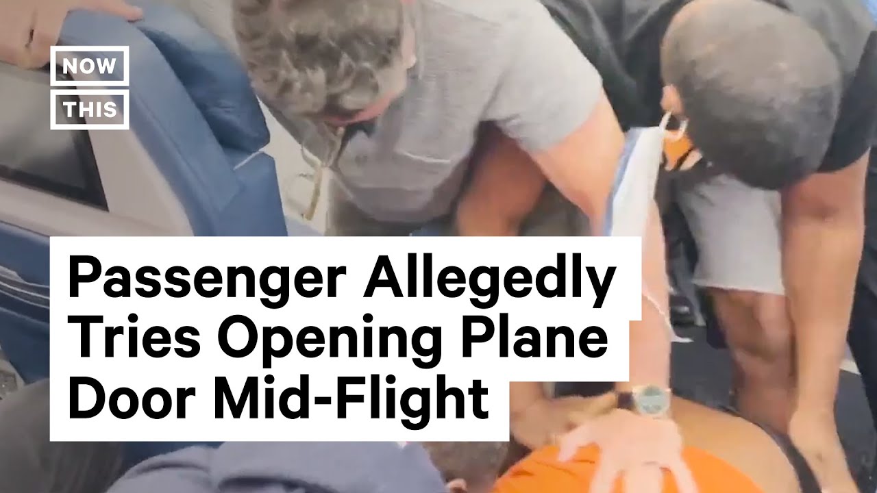 british tourist tries to open door on flight