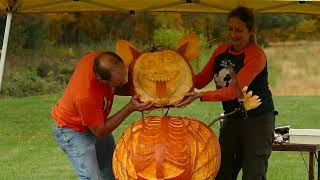 Artists carve huge pumpkins at annual drive-thru, walk-up display
